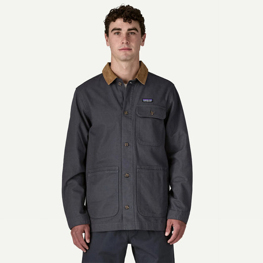 Patagonia Point Reyes Canvas Jacket Man wearing a blue canvas jacket with corduroy collar .