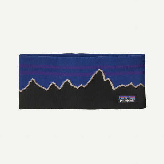 A blue and black headband with a mountain range design on a white background.