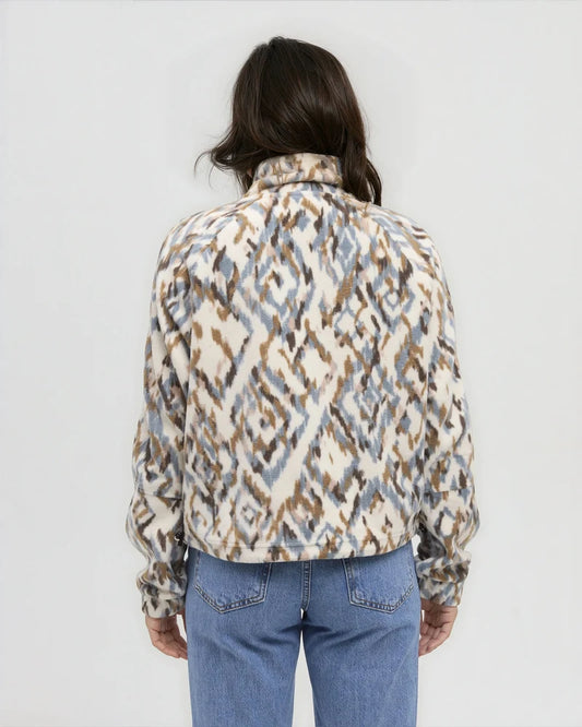 The back view of a woman wearing a multi coloured full zip