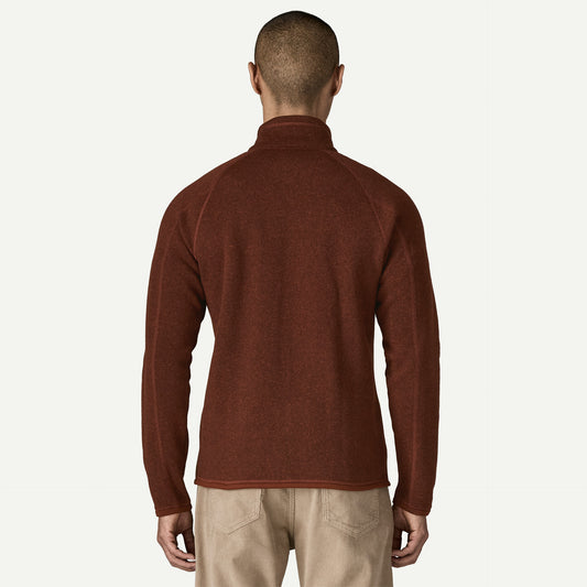 Patagonia Better Sweater Jacket a man stands with his back facing the camera wearing a full zip fleece jacket.