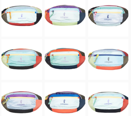 A collection of Cotopaxi Kapai 1.5L hip packs in various color combinations, featuring a large main compartment and a zippered front accessory pocket.