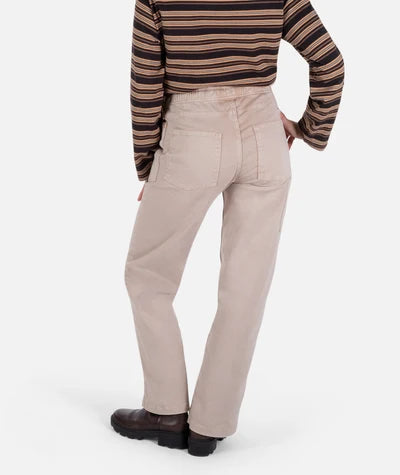 Person wearing beige pants and a striped sweater on a white background