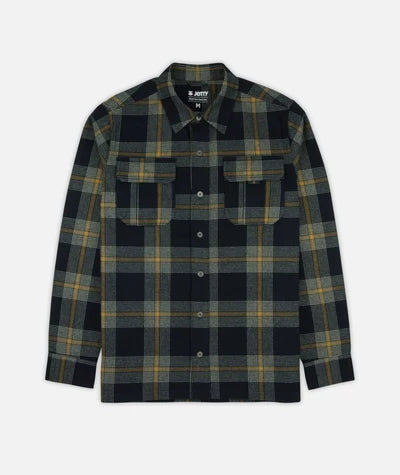 A long-sleeve button-up flannel shirt by Jott, featuring a dark navy and black plaid pattern with yellow and green stripes, displayed on a light gray background.