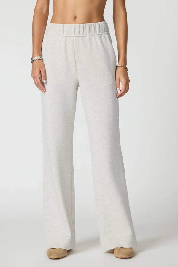MPG  Dreamweave Relaxed Pants White wide-leg pants worn by a person on a white background