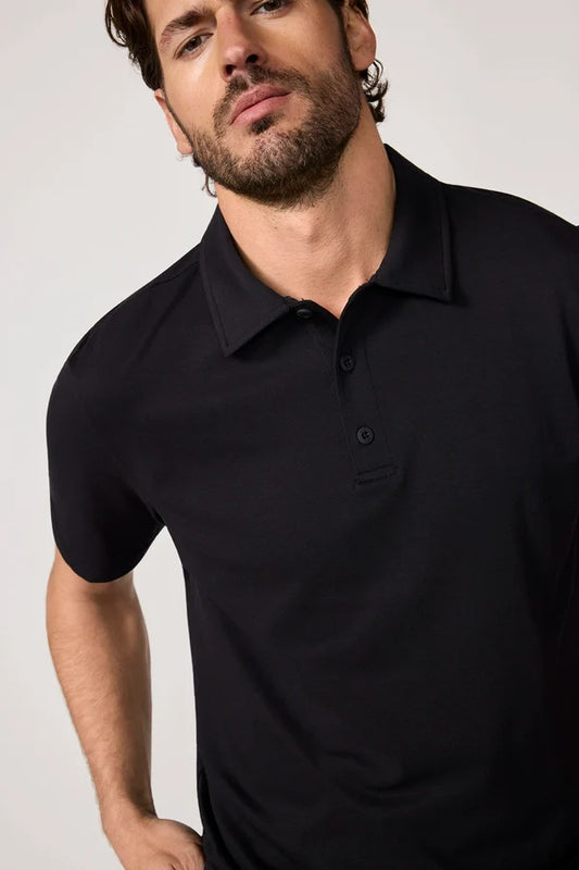 MPG Revive Short Sleeve Polo man wearing black polo shirt