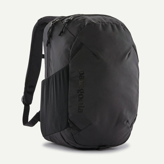 Patagonia Atom 24L Black backpack with Patagonia branding on a light gray background