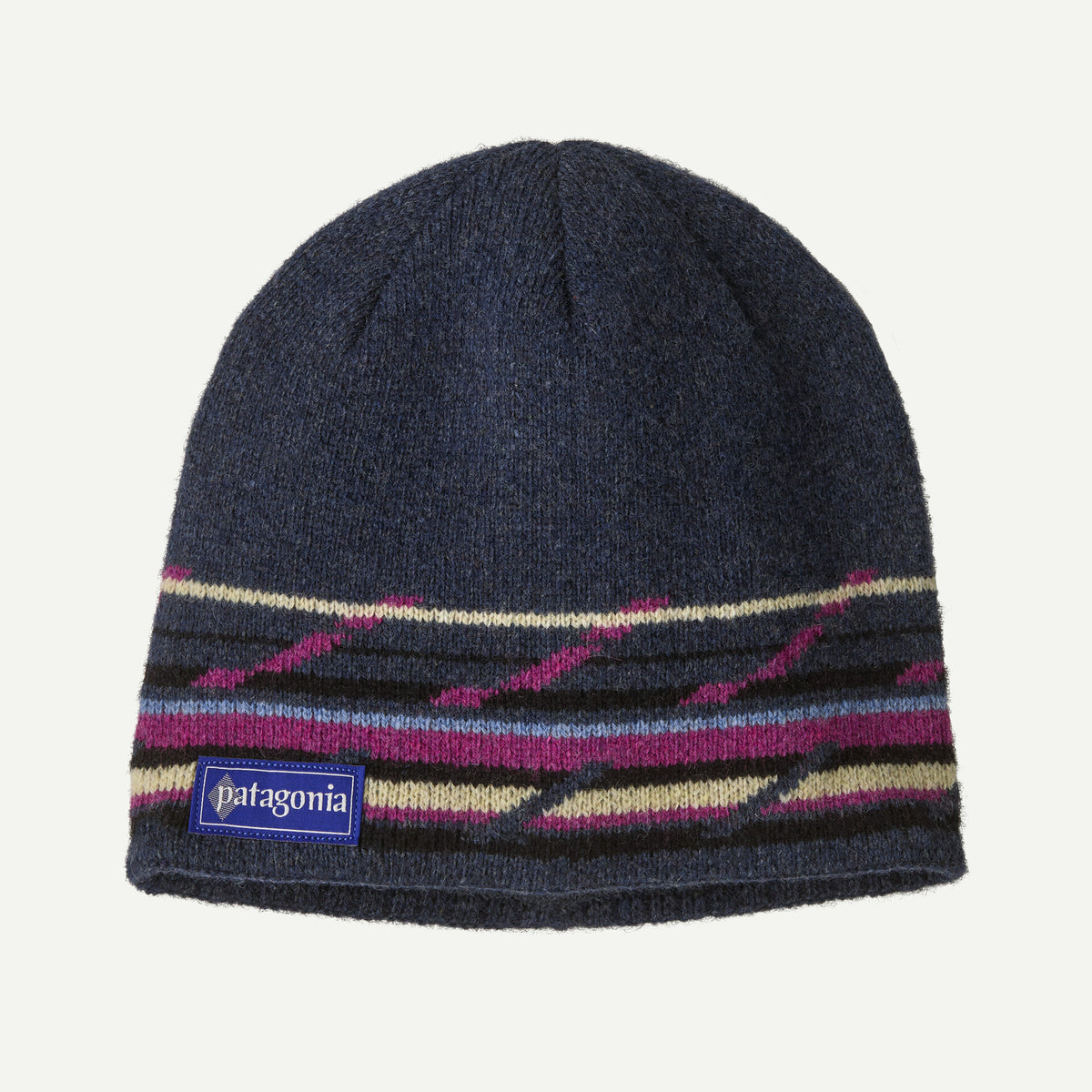 A blue beanie with multi coloured stripes on a white background