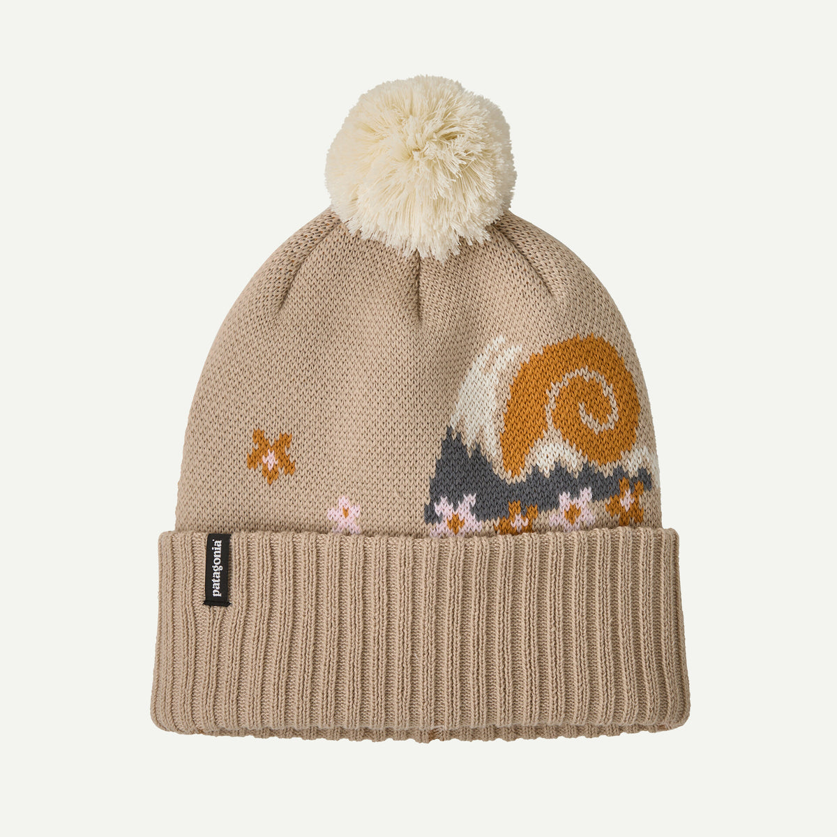 A tan beanie with white pom pom on  a white background