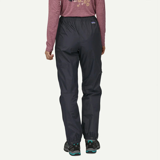 Patagonia Torrent Shell 3L Pants a view of the back of a woman wearing rain proof pants