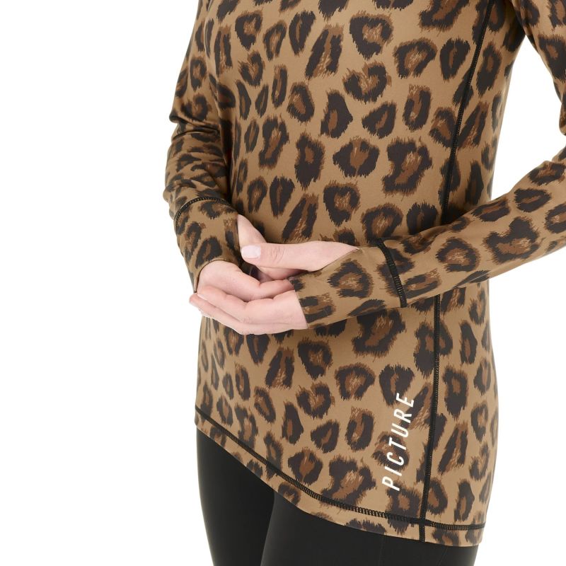  Close up of a woman woman's hands wearing a animal print base layer with thumb holes