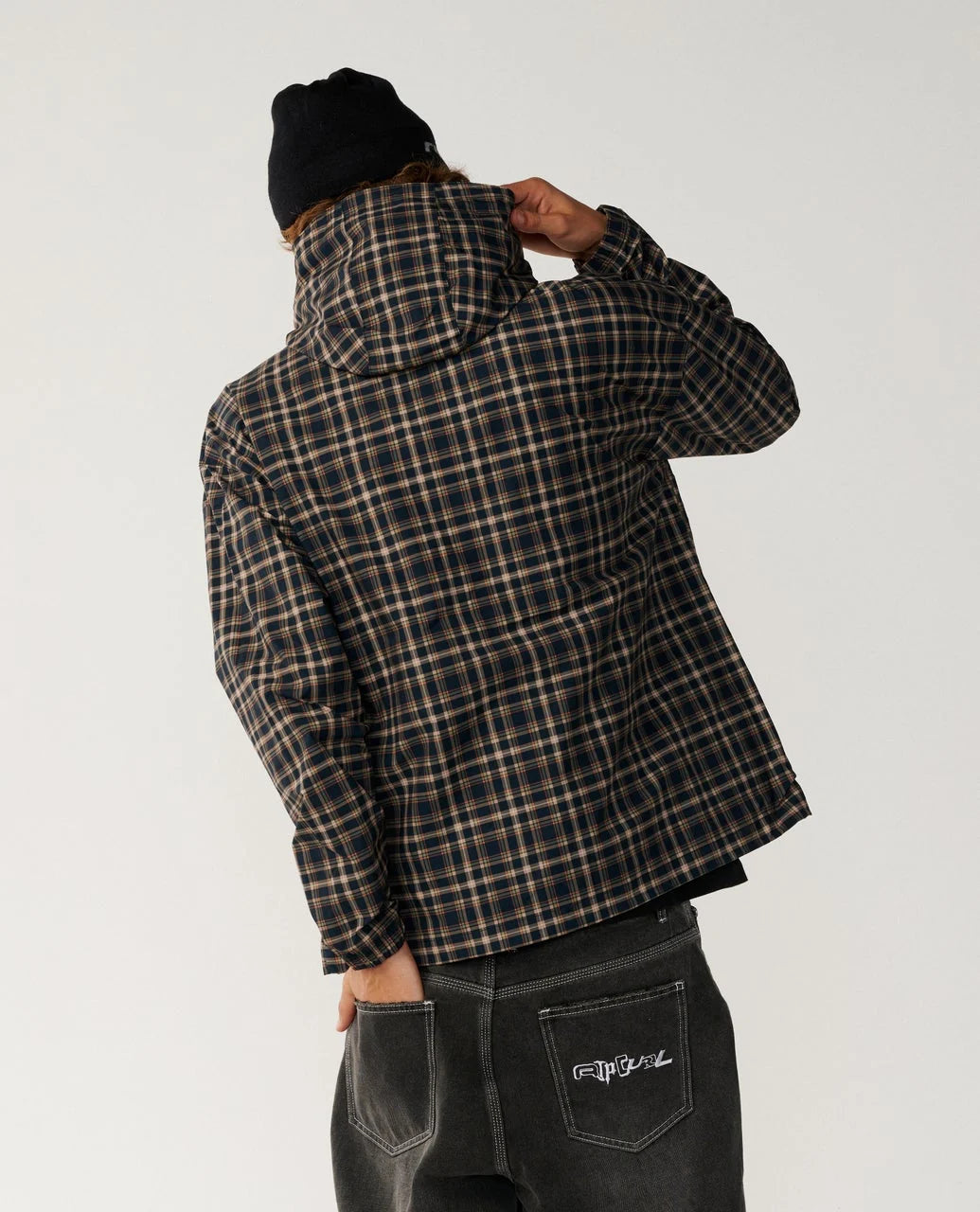 Rip Curl Archive DWR Plaid Jacket Person wearing a plaid jacket and black beanie on a plain background