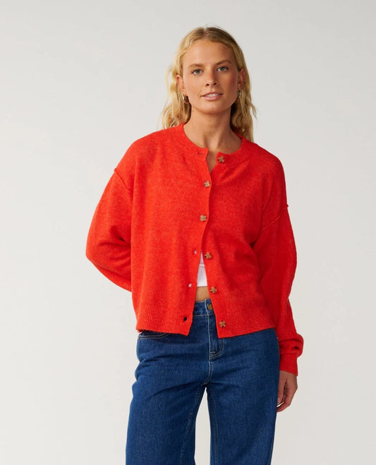 Rip Curl Emily Cardigan a woman wearing a red cardigan with jeans on, 2 buttons done up