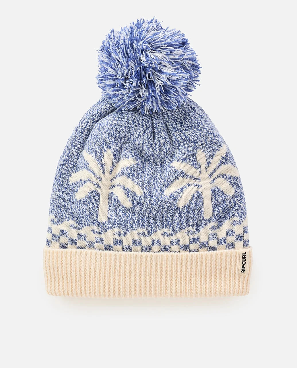 A blue and white pom pom toque / beanie in a white studio space
