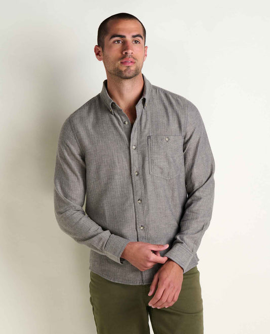Toad & Co Airsmyth Long Sleeve Shirt a man standing with a grey button down shirt and green pants with a white background
