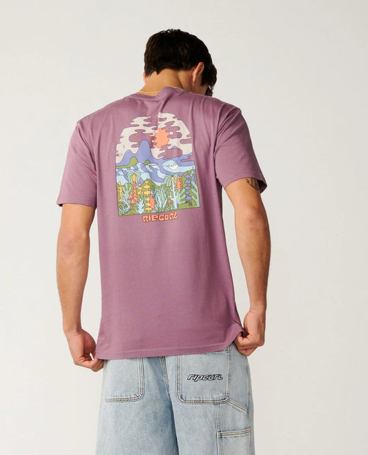 Person wearing a purple t-shirt with a colorful graphic on the back, standing against a plain background.