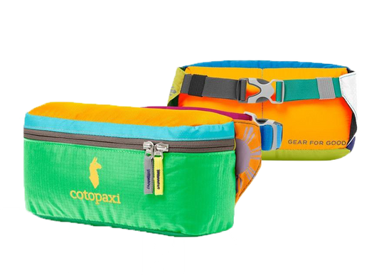 Cotopaxi Bataan Fanny Pack in green with orange and blue accents, featuring the brand's logo and designed with an adjustable hip belt and zipper closure.